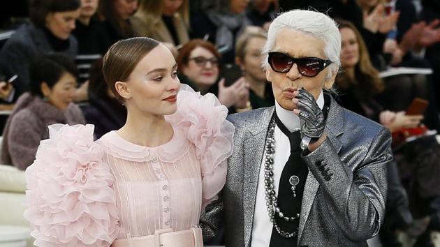Lily-Rose Depp models with German fashion designer Karl Lagerfeld during Chanel's Haute Couture Spring-Summer 2017 fashion collection prsented in Paris on Tuesday. (AP) 