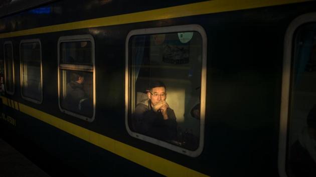 Passengers wait for the departure of their train as they travel to their hometowns for the "Spring Festival" or Lunar New Year on January 23, 2017 at Beijing Railway Station. (AFP Photo) Passengers wait for the departure of their train as they travel to their hometowns for the "Spring Festival" or Lunar New Year on January 23, 2017 at Beijing Railway Station. (AFP Photo)
