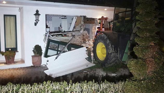 A tractor stands in front of a damaged house after it broke through the wall in Buende, north-western Germany on Thursday. Unknown intruders steered the tractor into the house and broke through the wall in order to steal a safe. The residents were not injured.(Nord-West-Media TV/AP) A tractor stands in front of a damaged house after it broke through the wall in Buende, north-western Germany on Thursday. Unknown intruders steered the tractor into the house and broke through the wall in order to steal a safe. The residents were not injured.(Nord-West-Media TV/AP)