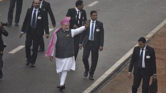 Prime Minister Modi waves at the people at the end of the Republic Day Parade at Rajpath in New Delhi on Thursday. (Raj K Raj/ HT photo)