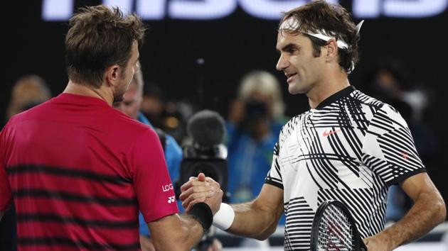 Switzerland's Roger Federer, right, is congratulated by compatriot Stan Wawrinka. (AP)