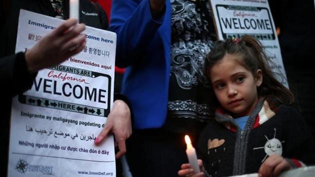 Maya Casillas, 7, attends a vi1gil in Los Angeles, in response to President Donald Trump's executive orders relating to immigration , California, US. (Reuters) Maya Casillas, 7, attends a vi1gil in Los Angeles, in response to President Donald Trump's executive orders relating to immigration , California, US. (Reuters)