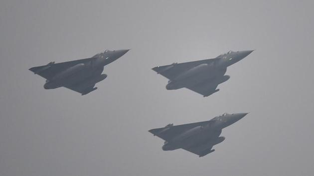 Indigenously developed light combat aircraft Tejas fly during the Republic Day parade in New Delhi on Thursday. (Raj K Raj/HT PHOTO) Indigenously developed light combat aircraft Tejas fly during the Republic Day parade in New Delhi on Thursday. (Raj K Raj/HT PHOTO)