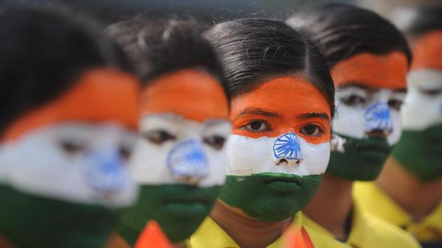 School students wearing facepaint depicting the national flag take part in an event to mark Republic Day in Chennai. (AFP) School students wearing facepaint depicting the national flag take part in an event to mark Republic Day in Chennai. (AFP)