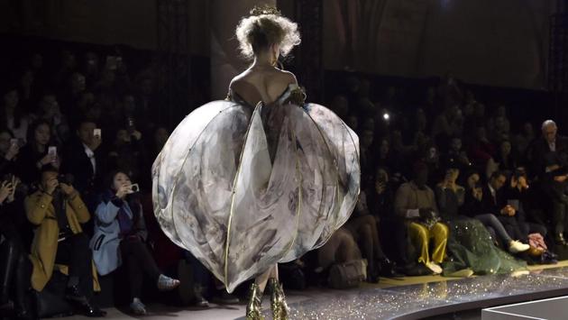 A model presents a creation by Guo Pei during the 2017 spring/summer Haute Couture collection on Thursday. (AFP) A model presents a creation by Guo Pei during the 2017 spring/summer Haute Couture collection on Thursday. (AFP)