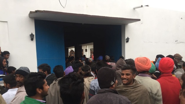 Villagers outside a house where SGPC member Mandwala was reportedly sitting inside. Villagers outside a house where SGPC member Mandwala was reportedly sitting inside.