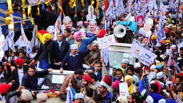 Aam Aadmi Party national convenor and Delhi chief minister Arvind Kejriwal with party MP Bhagwant Mann and AAP MLA candidate Balbir Singh wave to their supporters during a road show in Patiala. (PTI Photo) Aam Aadmi Party national convenor and Delhi chief minister Arvind Kejriwal with party MP Bhagwant Mann and AAP MLA candidate Balbir Singh wave to their supporters during a road show in Patiala. (PTI Photo)