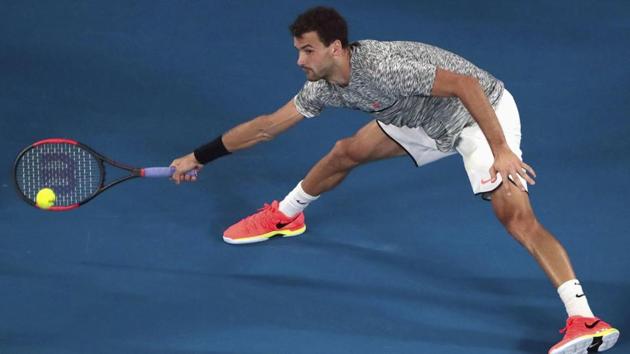 Grigor Dimitrov hits a shot during his Men's singles semi-final match against Rafael Nadal. (REUTERS)