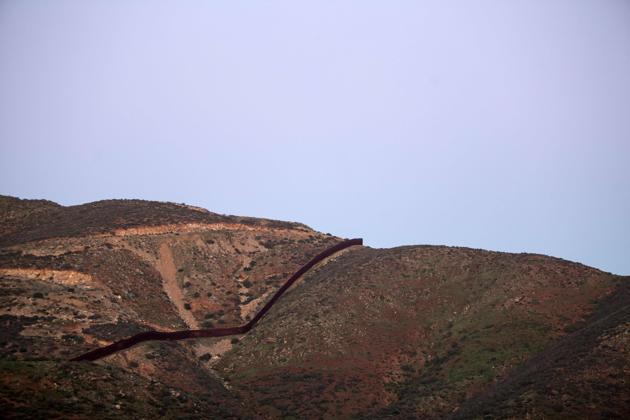 President Donald Trump ordered work to begin on building a wall across the Mexican border. (AFP Photo)