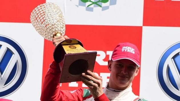 Mick Schumacher at the top rung of the podium after winning Race 1 of the MRF Challenge third round races at the Buddh International Circuit in Greater Noida on Saturday (HT Photo) Mick Schumacher at the top rung of the podium after winning Race 1 of the MRF Challenge third round races at the Buddh International Circuit in Greater Noida on Saturday (HT Photo)