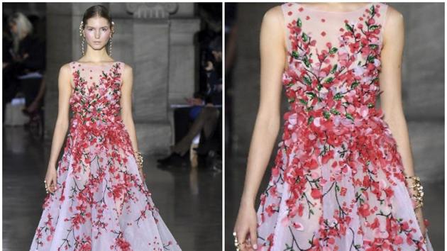 Georges Hobeika: With volume, length, fluidity and intricate embroidery, this sumptuous gown ticks all the boxes as a potential red carpet contender for 2017. The embroidered flowers seem to climb from the bottom of the dress, blooming into a bouquet at the waist and bust, adding a romantic touch that could appeal to several stars. (AFP) Georges Hobeika: With volume, length, fluidity and intricate embroidery, this sumptuous gown ticks all the boxes as a potential red carpet contender for 2017. The embroidered flowers seem to climb from the bottom of the dress, blooming into a bouquet at the waist and bust, adding a romantic touch that could appeal to several stars. (AFP)