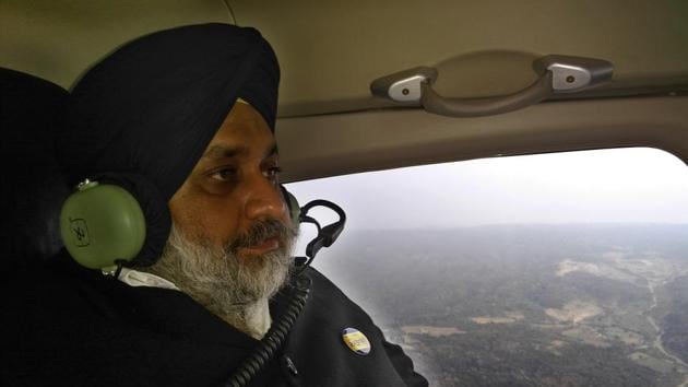 Shiromani Akali Dal president Sukhbir Singh Badal on a chopper on Saturday.(HT Photo)