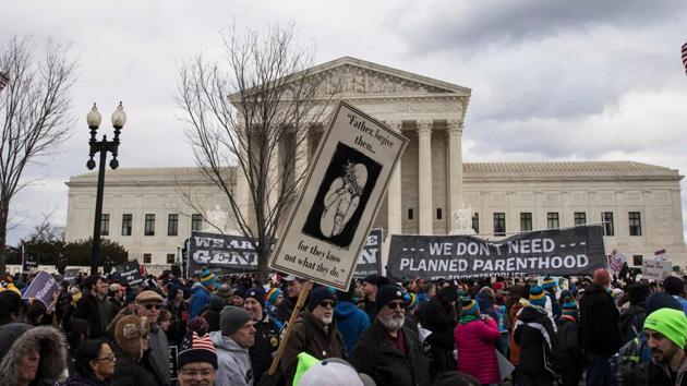 Pro-life demonstrators protest in front of the US Supreme Court during the 44th annual March for Life in Washington, DC, on Friday. Anti-abortion advocates descended on the US capital on Friday for an annual march expected to draw the largest crowd in years, with the White House spotlighting the cause and throwing its weight behind the campaign. (AFP Photo) Pro-life demonstrators protest in front of the US Supreme Court during the 44th annual March for Life in Washington, DC, on Friday. Anti-abortion advocates descended on the US capital on Friday for an annual march expected to draw the largest crowd in years, with the White House spotlighting the cause and throwing its weight behind the campaign. (AFP Photo)