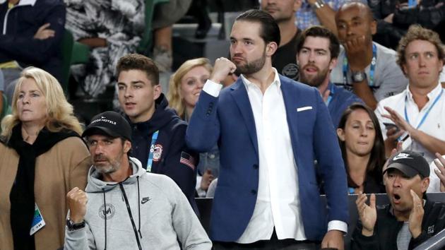 Alexis Ohanian (centre), fiance of Serena Williams, and other supporters in her player box react during the final in Melbourne on Saturday. (AP)