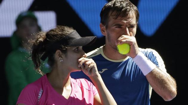 India's Sania Mirza, left, and partner Ivan Dodig of Croatia will play the Australian Open mixed doubles final in Melbourne on Sunday. Live streaming of the match will be available online.(AP)