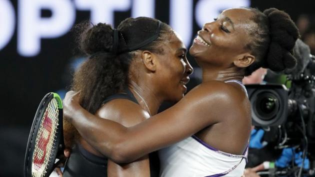 Venus Williams (right) embraces her sister after the Australian Open final. (AP)