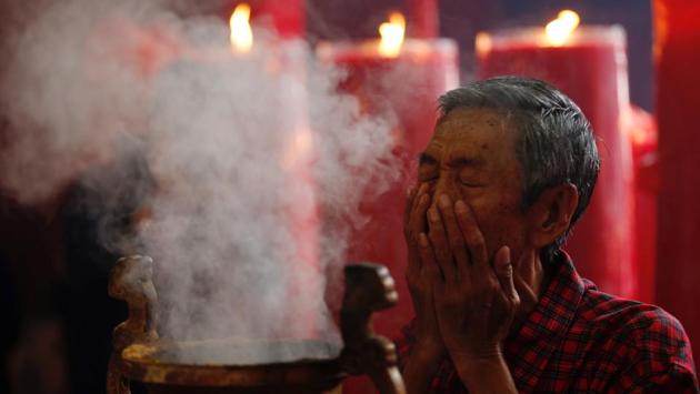 A man prays during Lunar New Year celebrations at Dharma Bhakti temple in Jakarta, Indonesia. (Darren Whiteside/REUTERS)