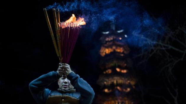 Residents of China’s capital woke on Saturday to dense, choking smog after many set off a barrage of fireworks overnight to ring in the Lunar New Year, despite limits and public admonitions against such displays in the congested city. (Johannes Eisele/AFP)