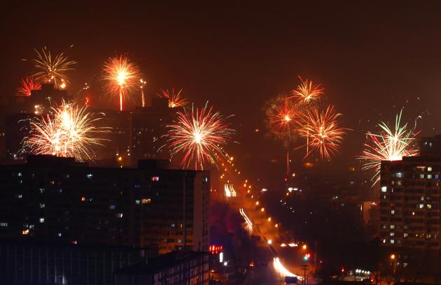 Beijing residents celebrate the Lunar New Year by bursting crackers on Saturday early morning. (Reuters) Beijing residents celebrate the Lunar New Year by bursting crackers on Saturday early morning. (Reuters)