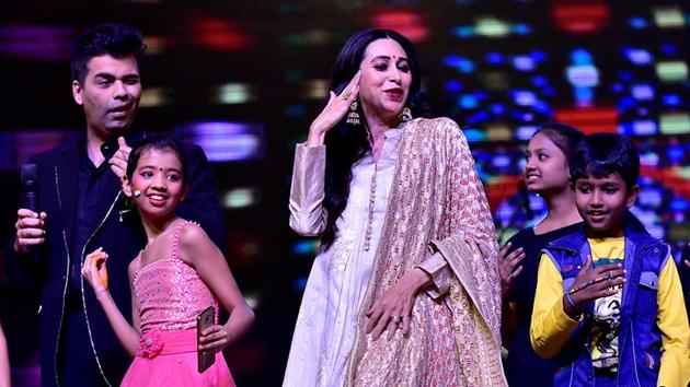 Film-maker Karan Johar and actor Karisma Kapoor during the function. (Arijit Sen/HT PHOTO)