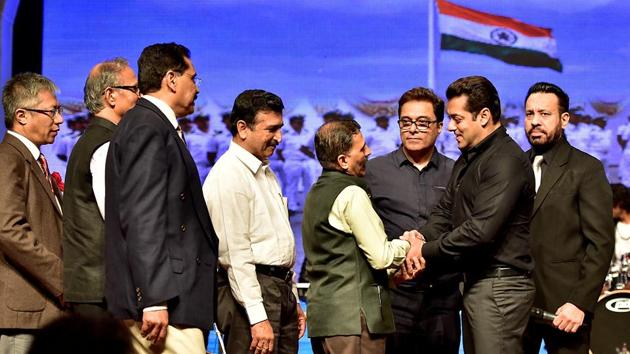Senior officers of the customs department greet actor Salman Khan during the function at Shanmukhananda Hall. (Arijit Sen/HT PHOTO)