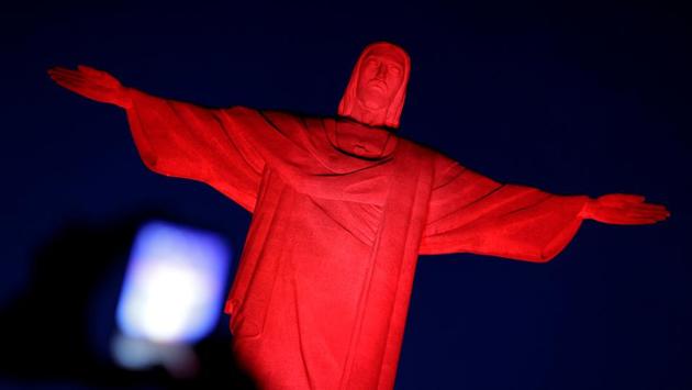 The statue of Christ the Redeemer is illuminated in red in honor of the Chinese Lunar New Year in Rio de Janeiro, Brazil. (Ueslei Marcelino/REUTERS)