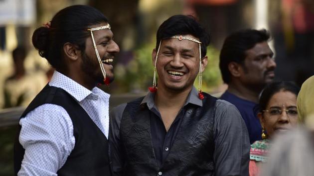 People share a light moment during the march. (Arijit Sen/HT PHOTO)