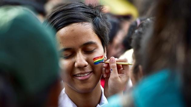A girl gets her face painted as she participates in the parade at August Kranti Maidan. (Arijit Sen/HT PHOTO)