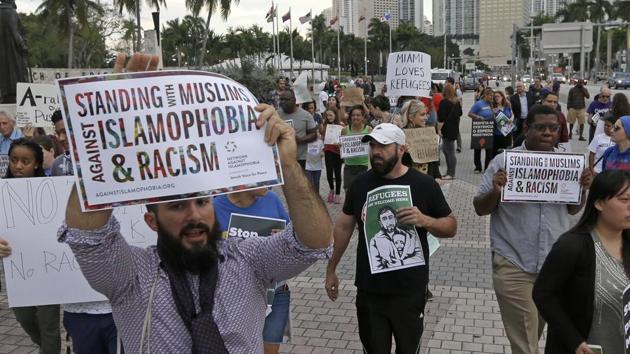 Protesters chant slogans against President Donald Trump's executive order on Muslim immigration, in downtown Miami.(AP Photo) Protesters chant slogans against President Donald Trump's executive order on Muslim immigration, in downtown Miami.(AP Photo)