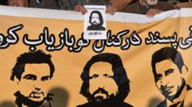 Pakistani rights activists hold images of bloggers reported missing during a protest in Islamabad on January 10, 2017. (AFP) Pakistani rights activists hold images of bloggers reported missing during a protest in Islamabad on January 10, 2017. (AFP)