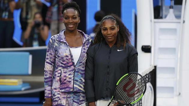 The Williams sisters pose for a photo ahead of their women's final in Melbourne on Saturday. (REUTERS)