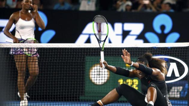 Venus Williams (left) allows her sister bask in the glory after winning the Australian Open final. (REUTERS)