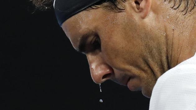 Sweat drips from the face of Spain's Rafael Nadal during a break in his semifinal against Bulgaria's Grigor Dimitrov at the Australian Open tennis championships in Melbourne, Australia, on January 27, 2017. (Kin Cheung / AP) Sweat drips from the face of Spain's Rafael Nadal during a break in his semifinal against Bulgaria's Grigor Dimitrov at the Australian Open tennis championships in Melbourne, Australia, on January 27, 2017. (Kin Cheung / AP)
