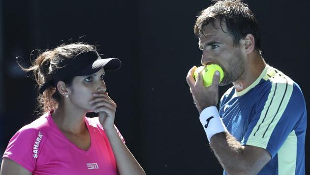 India's Sania Mirza and Ivan Dodig of Croatia talking during their mixed doubles' final against Abigail Speers of the US and Juan Sebastian Cabal of Colombia at the Australian Open tennis championships in Melbourne, Australia on Jan. 29, 2017. (Aaron Favila) / AP) India's Sania Mirza and Ivan Dodig of Croatia talking during their mixed doubles' final against Abigail Speers of the US and Juan Sebastian Cabal of Colombia at the Australian Open tennis championships in Melbourne, Australia on Jan. 29, 2017. (Aaron Favila) / AP)