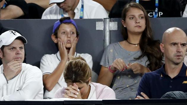 Mirka Federer (centre) can’t handle the pressure of watching her husband play, in Melbourne on Sunday. (AP)