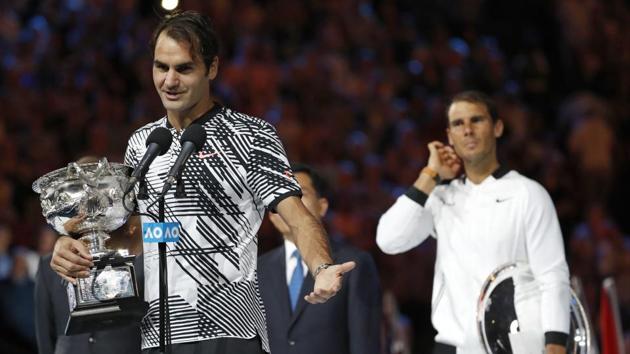 Roger Federer addresses the spectators, holding his trophy, after defeating Rafael Nadal. (AP)