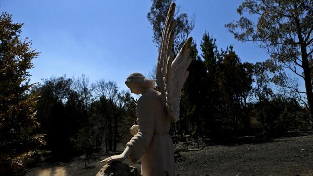 The sculpture of an angel stands at the entry of a house that was consumed by a forest fire in Florida, Chile, Saturday, Jan. 28, 2017. (Esteban Felix / AP) The sculpture of an angel stands at the entry of a house that was consumed by a forest fire in Florida, Chile, Saturday, Jan. 28, 2017. (Esteban Felix / AP)