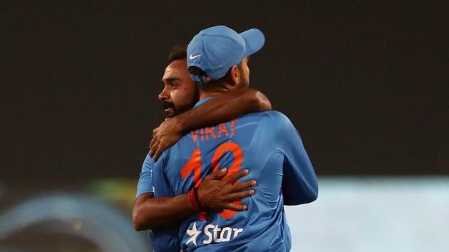 Amit Mishra celebrates the wicket of Eoin Morgan with India captain Virat Kohli during the 2nd T20I in Nagpur on Sunday.(BCCI)