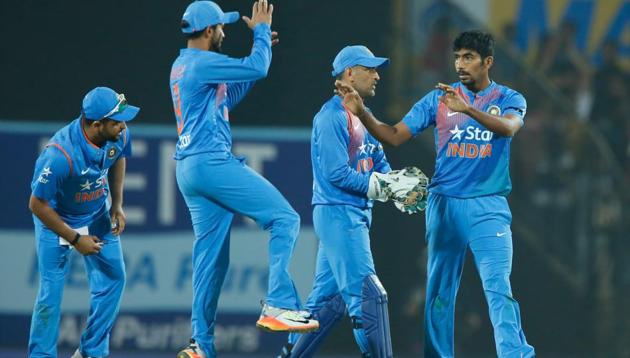 Jasprit Bumrah (right) celebrates after bowling a brilliant last over to guide India to a five-run win over England and level series 1-1. (BCCI)