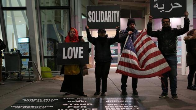 Protesters outside the JFK airport in Queens, New York City on Sunday. (Reuters photo) Protesters outside the JFK airport in Queens, New York City on Sunday. (Reuters photo)