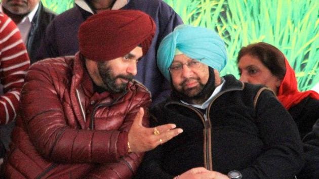 Punjab Pradesh Congress Committee president and party's Punjab CM candidate Captain Amarinder Singh and Navjot Singh Sidhu at an elecation rally in Jalalabad Fazilka district on Saturday. (PTI) Punjab Pradesh Congress Committee president and party's Punjab CM candidate Captain Amarinder Singh and Navjot Singh Sidhu at an elecation rally in Jalalabad Fazilka district on Saturday. (PTI)