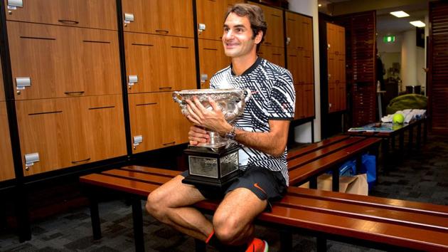 Switzerland's Roger Federer with his prize, the Norman Brookes Challenge Cup, after beating Rafael Nadal in the final to win the Australian Open on Sunday.(REUTERS) Switzerland's Roger Federer with his prize, the Norman Brookes Challenge Cup, after beating Rafael Nadal in the final to win the Australian Open on Sunday.(REUTERS)