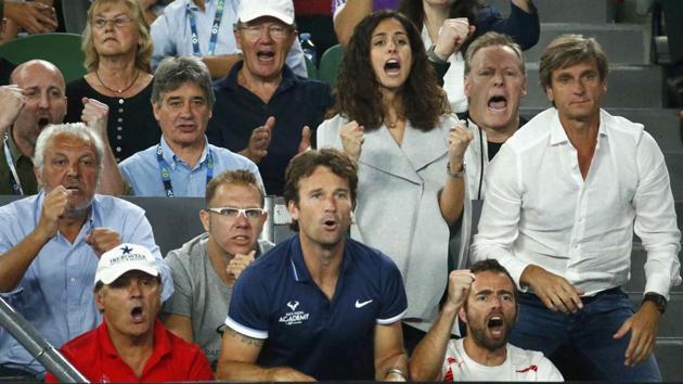 The box of Rafael Nadal erupts after he wins a point during the Australian Open final on Sunday. (REUTERS)