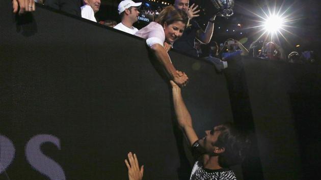 Roger Federer holds wife Mirka’s hand after winning the Australian Open final. (REUTERS)