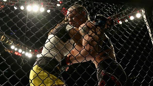 Julianna Pena and Valentina Shevchenko in action during their women's Bantamweight division at the Ultimate Fighting Championship event in Denver. (Getty Images) Julianna Pena and Valentina Shevchenko in action during their women's Bantamweight division at the Ultimate Fighting Championship event in Denver. (Getty Images)