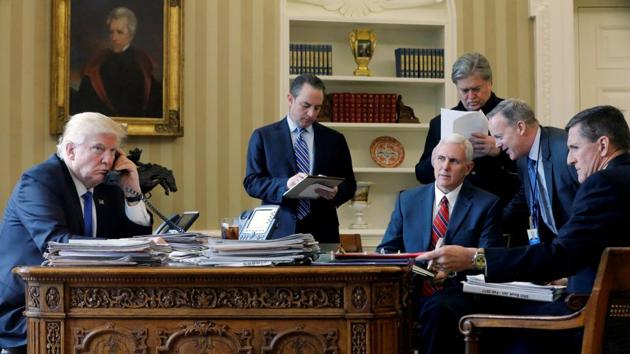 US President Donald Trump is joined by (L-R) chief of staff Reince Priebus, vice-president Mike Pence, senior advisor Steve Bannon, communications director Sean Spicer and national security advisor Michael Flynn (not seen) for his phone conversation with Russia's President Vladimir Putin in the Oval Office at the White House in Washington, US, on January 28, 2017. (Reuters) US President Donald Trump is joined by (L-R) chief of staff Reince Priebus, vice-president Mike Pence, senior advisor Steve Bannon, communications director Sean Spicer and national security advisor Michael Flynn (not seen) for his phone conversation with Russia's President Vladimir Putin in the Oval Office at the White House in Washington, US, on January 28, 2017. (Reuters)