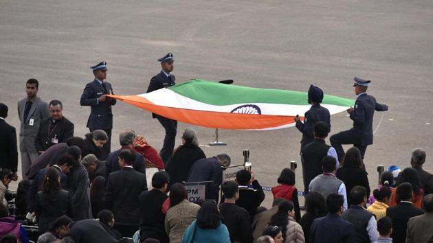 Nationalistic fervour: Air Force officers carry the tri-colour after the ceremony. (Arun Sharma/HT photo) Nationalistic fervour: Air Force officers carry the tri-colour after the ceremony. (Arun Sharma/HT photo)