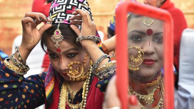 Folk dance artists from Uttarakhand get ready for their performance during ‘Bharat Parv’. The prime objective of organizing the event is to generate a patriotic mood, promote the rich cultural diversity of the country, ensure wider participation of the general public and to popularise the idea of Ek Bharat Shreshtha Bharat. (Raj K Raj/HT PHOTO)