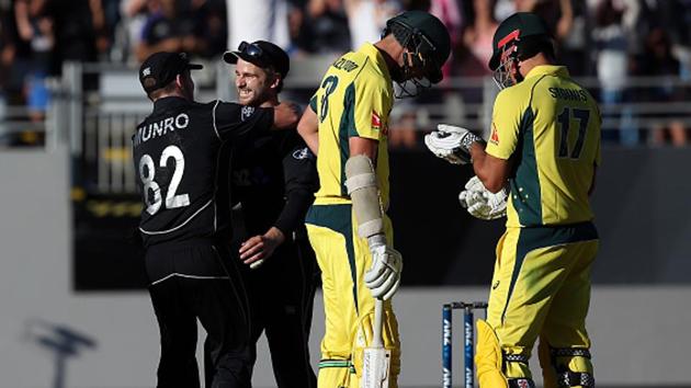 New Zealand's Kane Williamson (2nd L) and Colin Munro (L) celebrate after winning the match as Australia's Josh Hazlewood (second R) and Marcus Stoinis (R) look on during the one-day international (ODI) in Auckland.(AFP/Getty Images)
