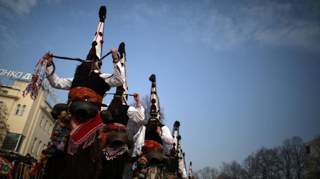 Dancers wearing masks take part in the International Festival of Masquerade Games Surva in Pernik on Sunday. (REUTERS) Dancers wearing masks take part in the International Festival of Masquerade Games Surva in Pernik on Sunday. (REUTERS)